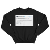 Alexandria Ocasio-Cortez all your base is us tweet on a black crewneck sweater from Tee Tweets