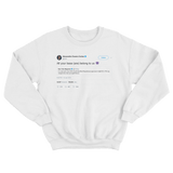 Alexandria Ocasio-Cortez all your base is us tweet on a white crewneck sweater from Tee Tweets