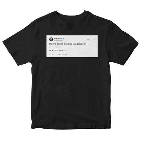 Nispey Hussle having strong enemies is a blessing tweet on a black t-shirt from Tee Tweets
